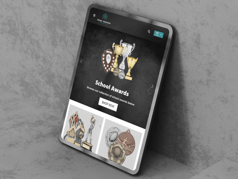 Prime Trophies website displayed on a tablet