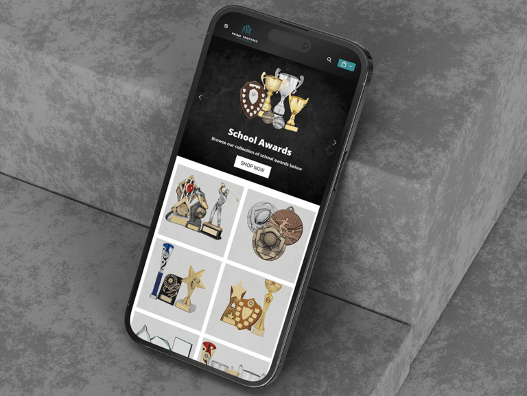 Prime Trophies website displayed on a mobile phone