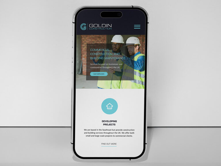Goldin Construction website displayed on a mobile phone