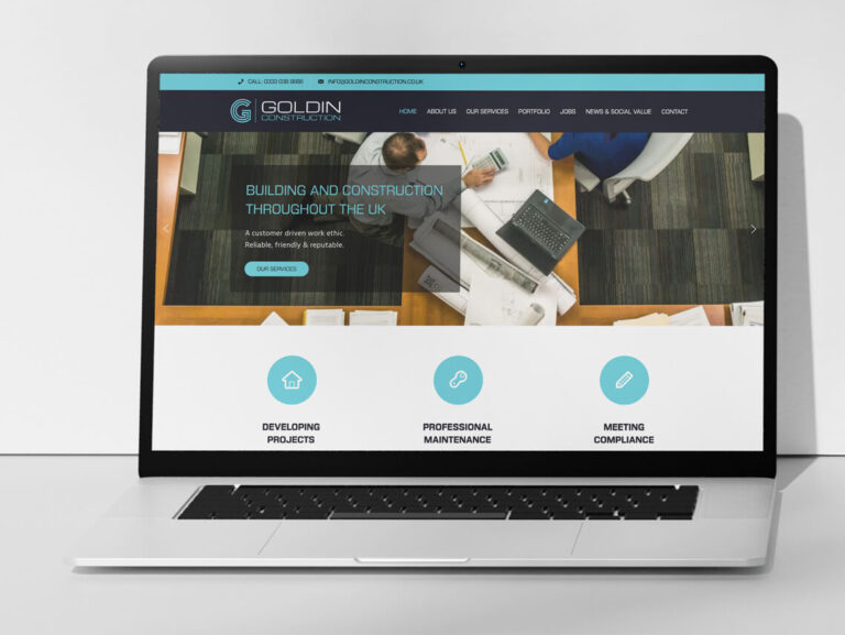Goldin Construction website displayed on a laptop