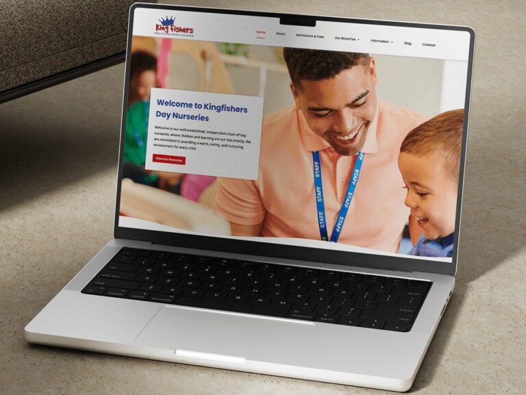 King Fishers Day Nurseries website displayed on a laptop
