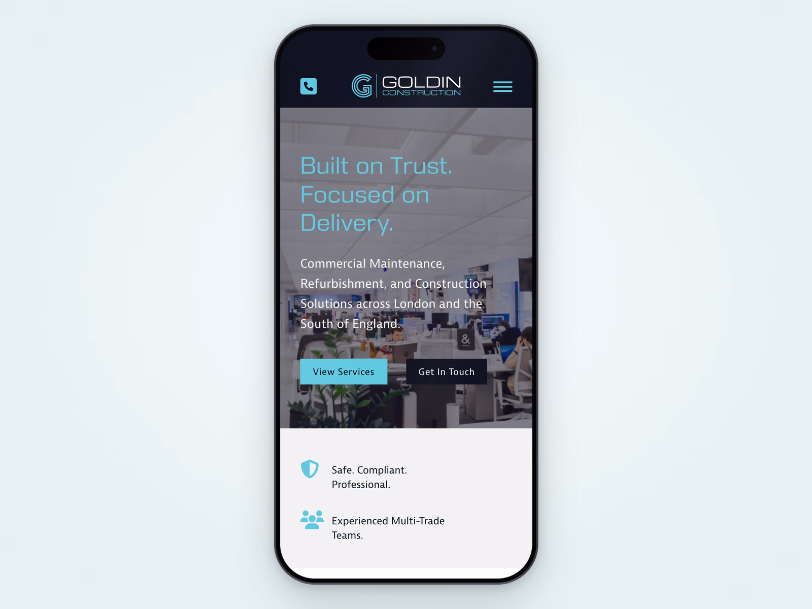 Goldin Construction website displayed on a mobile phone