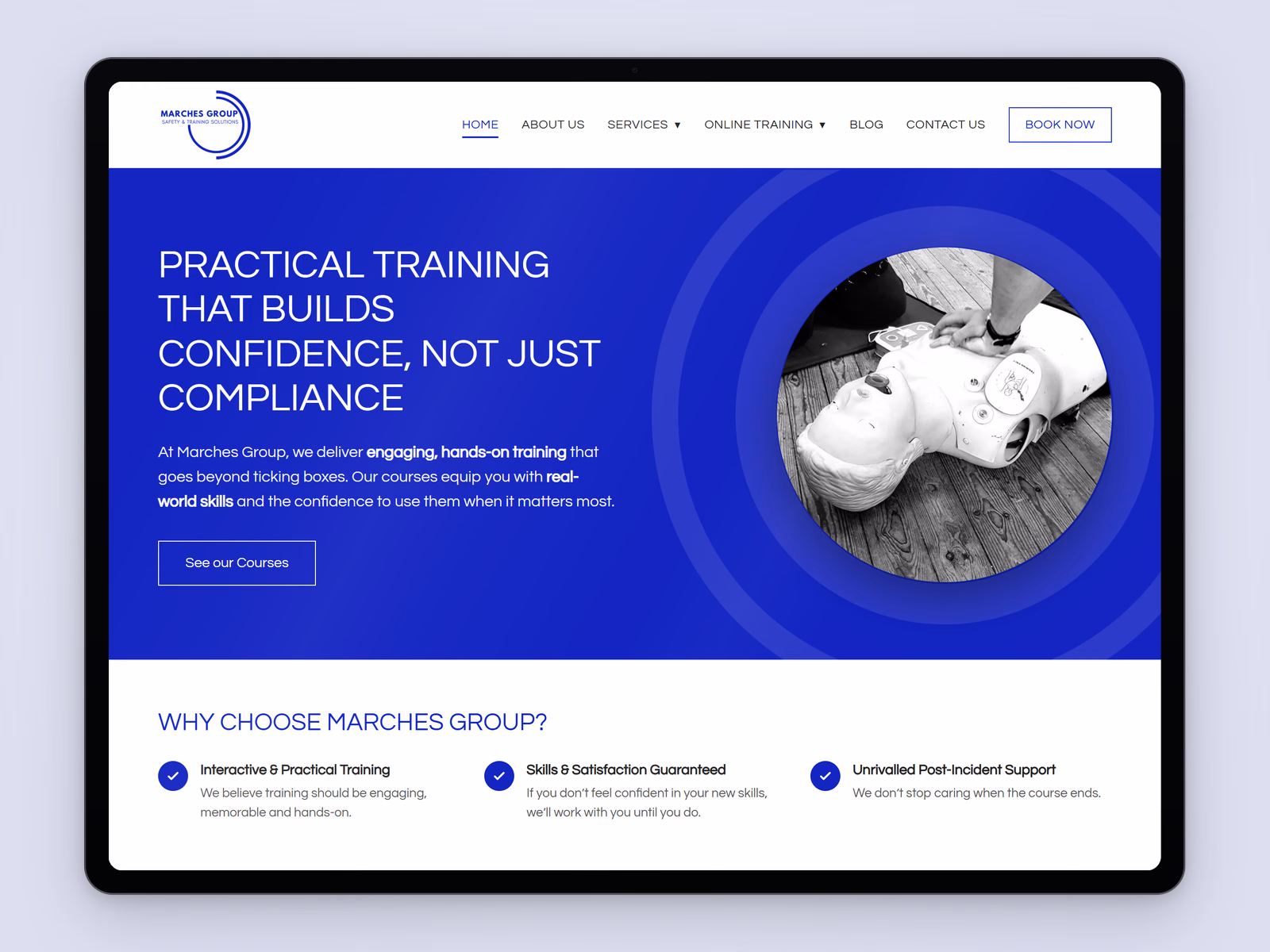Marches Group website displayed on a tablet