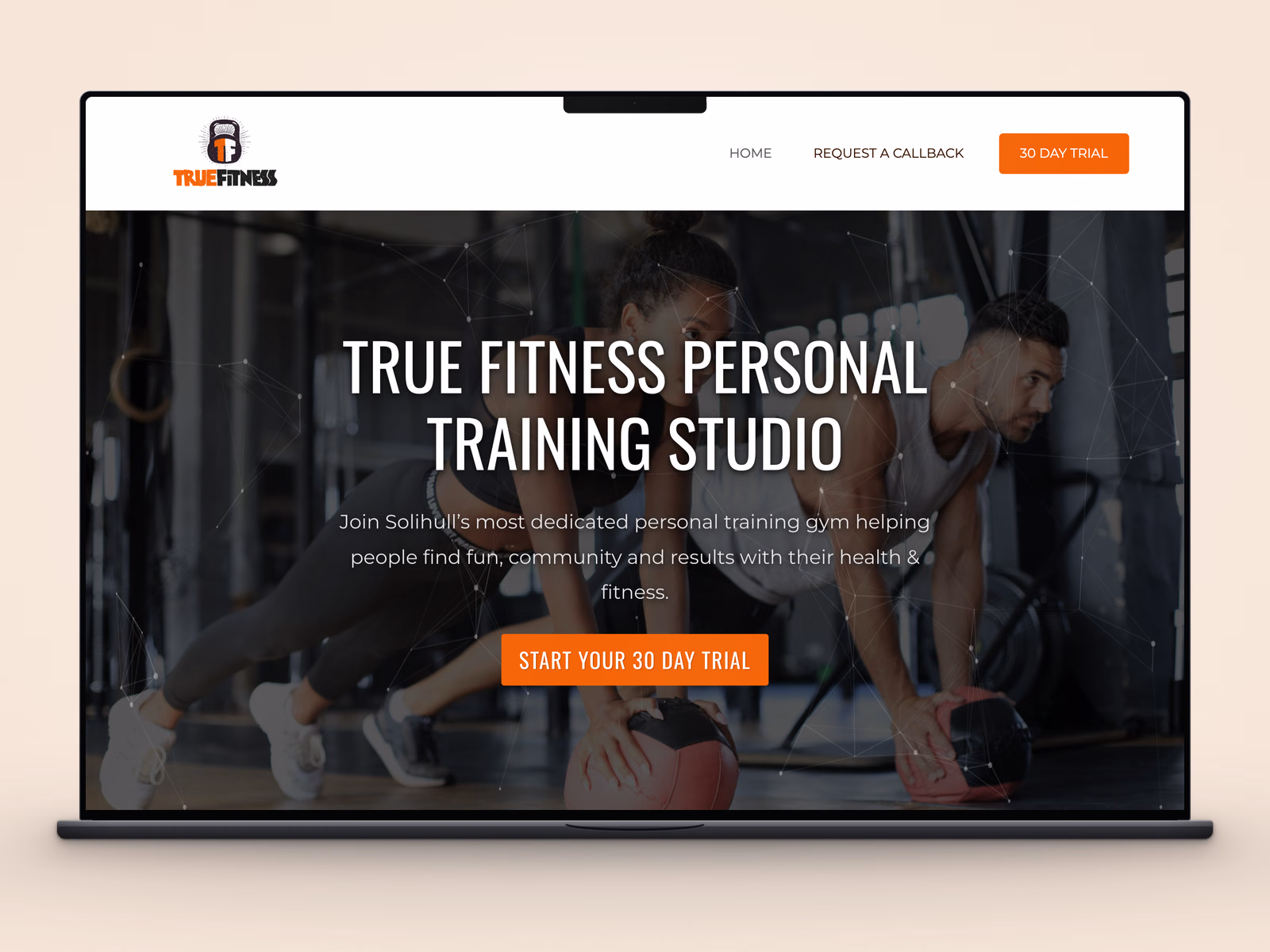 True Fitness Studio website displayed on a laptop